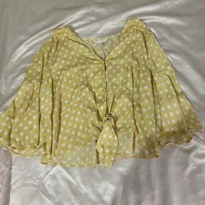 Yellow polka dotted blouse